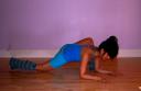 deep lunge with forearms on the floor with back knee down